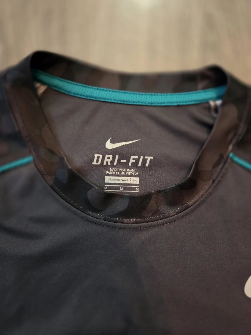 Nike Men’s Black Camo Performance Dri-FIT Tee with Teal Accents